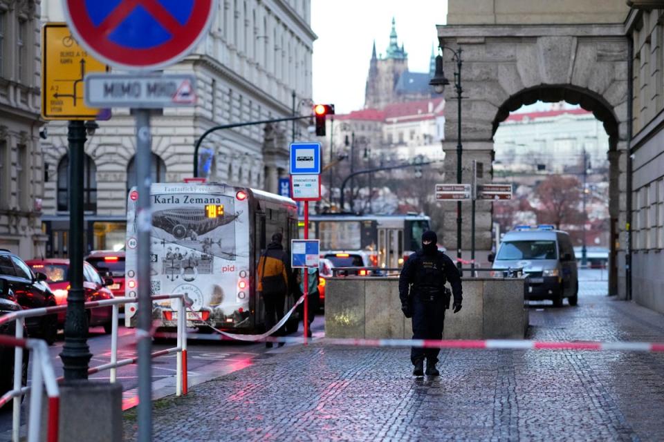 A policeman guards the area outside the building of Philosophical Faculty (Copyright 2023 The Associated Press. All rights reserved)