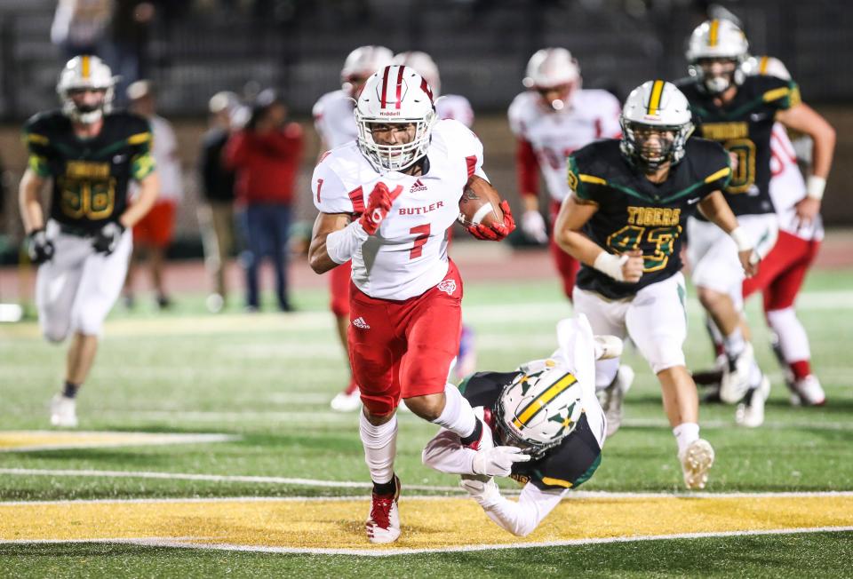 Butler's Jordan Watkins runs for yardage during the game against St. X.