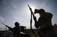 Volunteers from Belarus practice at a shooting range near Warsaw, Poland, on Friday, May 20, 2022. Belarusians are among those who have answered a call by Ukrainian President Volodymyr Zelenskyy for foreign fighters to go to Ukraine and join the International Legion for the Territorial Defense of Ukraine. (AP Photo/Michal Dyjuk)