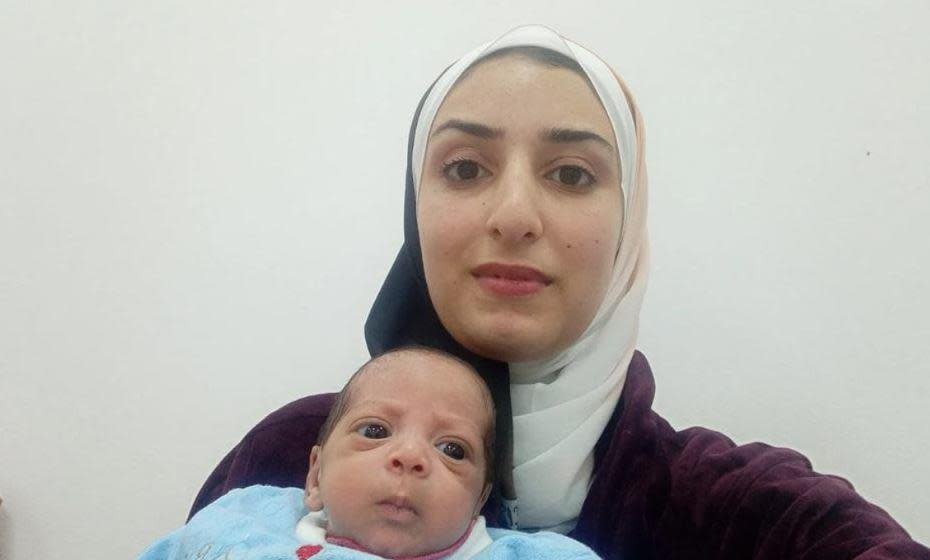 Noor Rihan holds her newborn son Ayman at a hospital in Egypt's New Administrative Capital, outside Cairo, Dec. 20, 2023. / Credit: Courtesy of Noor Rihan