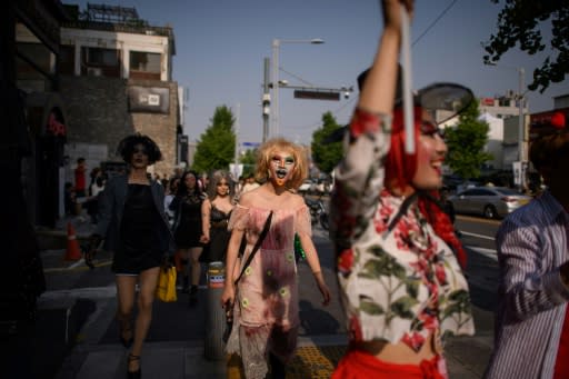 Dozens of drag queens and kings marched through Itaewon on Saturday, a suburb of Seoul best known for its nightlife and a nascent but vibrant gay scene