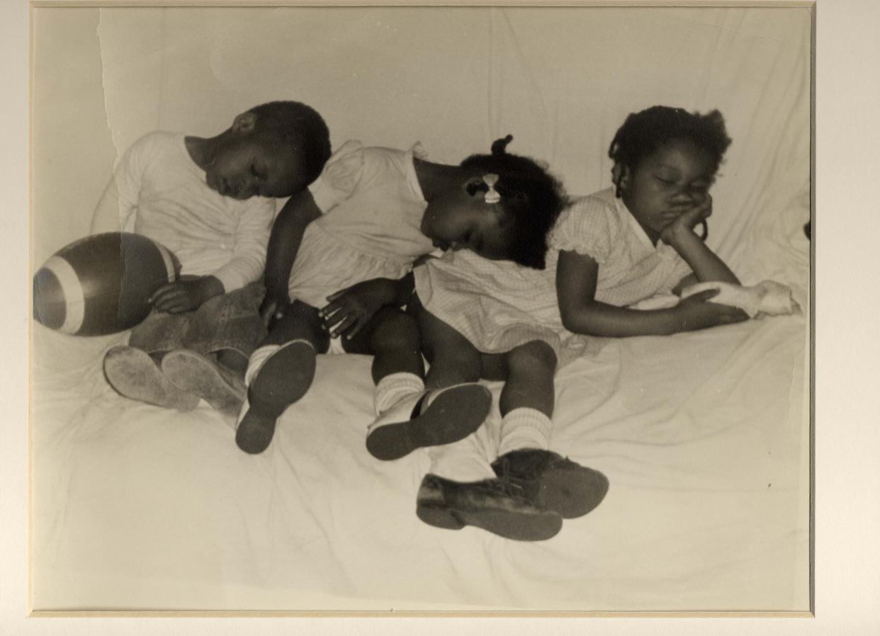 Photographer Taylor Matthews frequently would photograph the personal side of family life in the Black community by visiting the homes of friends. When it was part of a 2001 exhibit in the Keller Gallery at McKinley museum, this photo was titled simply, "Sleepy Time."
