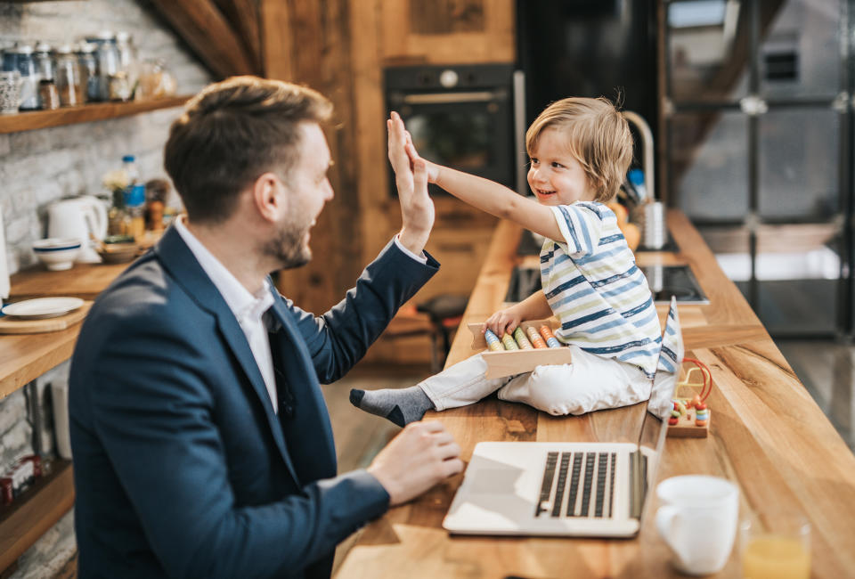 It's not necessary to wear a suit at home, but anything a level above your pajamas can help your brain to better anticipate the day's events. (Photo: skynesher via Getty Images)