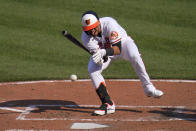 Baltimore Orioles' Rio Ruiz reacts after being hit by a pitch from Boston Red Sox starting pitcher Eduardo Rodriguez during the fourth inning of a baseball game, Thursday, April 8, 2021, on Opening Day in Baltimore. Ruiz swung on the pitch and wasn't awarded first base. (AP Photo/Julio Cortez)