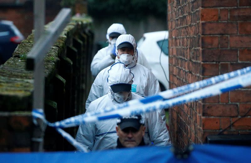 Forensic officers walk outside a property, which is being searched in connection with yesterday's stabbing on London Bridge, in which two people were killed, in Stafford