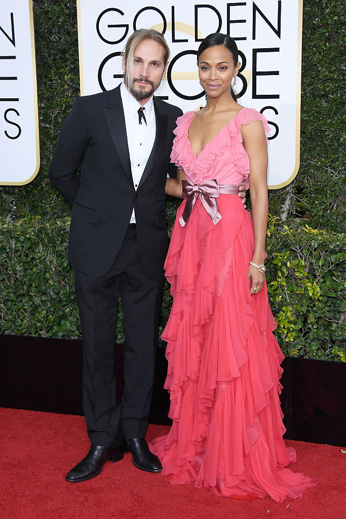 <p>Zoe shone in a flowing pink belted dress while her husband, Marco (and yes, he took her last name!), complemented her in a traditional tux. </p>