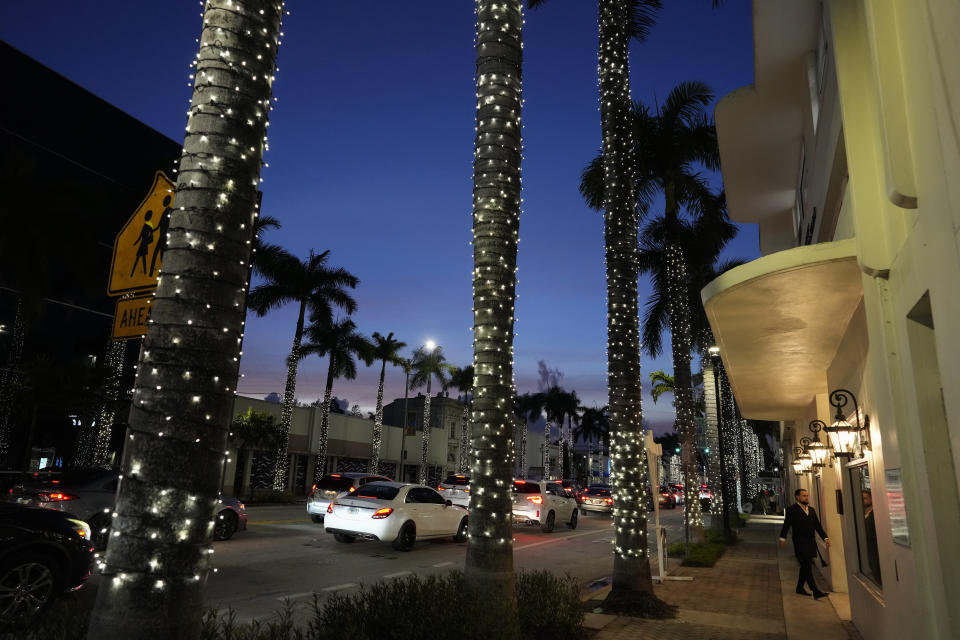 A Jewish man arrives at a synagogue for a Shabbat service in Miami Beach, Fla., Friday, Dec. 1, 2023. Many feel that having a joyful Hanukkah is another way to show defiance to terror — even though most will include in their family celebration somber prayers for the hostages still held by Hamas. (AP Photo/Rebecca Blackwell)