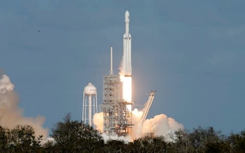 SpaceX Falcon Heavy rocket lifts off from the Kennedy Space Center in Cape Canaveral - Credit: Reuters