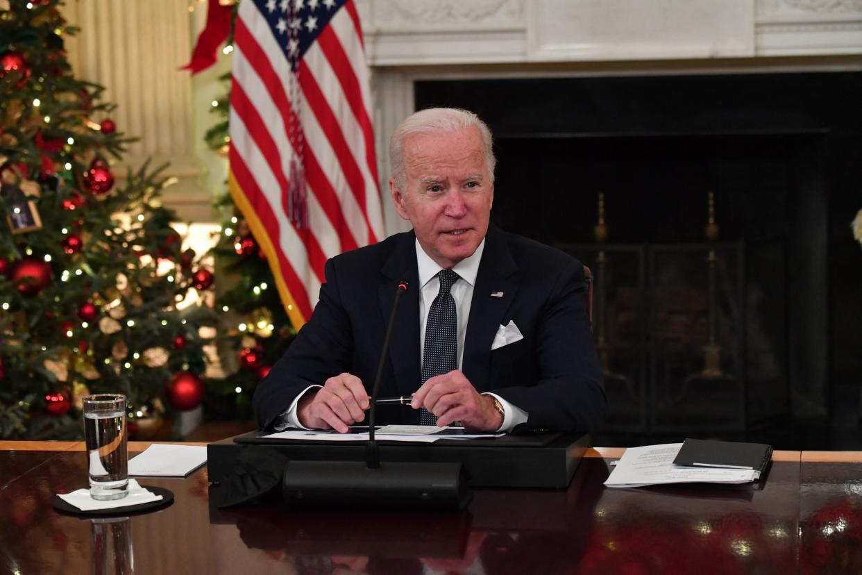 President Joe Biden speaks during his meeting with members of the White House Covid-19 Response Team on the latest developments related to the Omicron variant in the State Dining Room of the White House in Washington, DC, December 9, 2021. (Photo by Nicholas Kamm / AFP) (Photo by NICHOLAS KAMM/AFP via Getty Images)