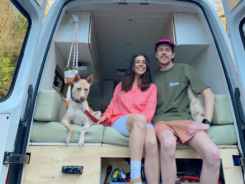 Sabrina and Nick in their Mercedes Sprinter van with one of their foster dogs.