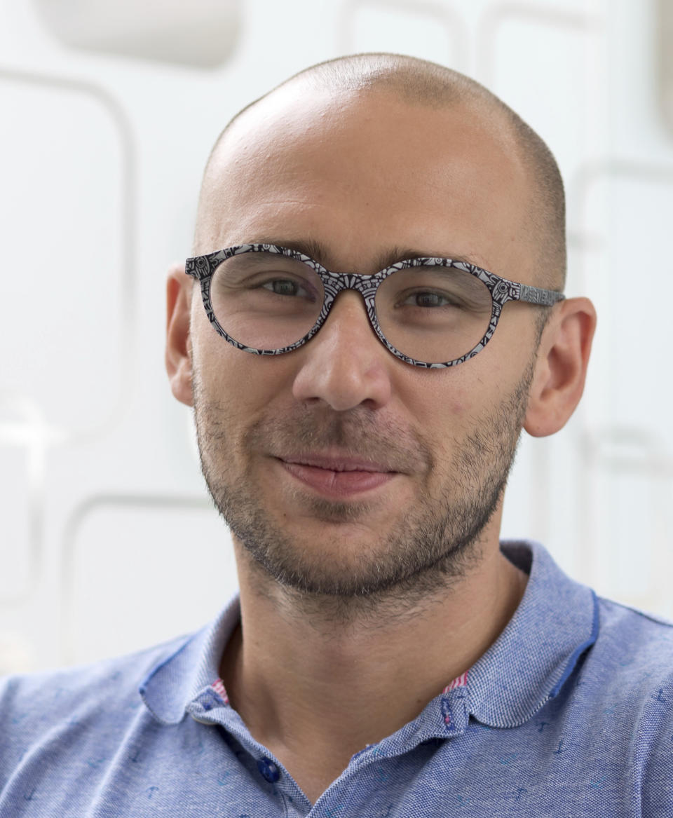 Italian Institute of Technology, IIT, researcher Francesco DiStasio poses for a portrait in this Jan. 1, 2018 photo at the IIT in Genoa, Italy. Backed by 261 billion euros from the EU and Italian government, the country’s recovery plan calls for a top-to-bottom shakeup of a major industrial economy long hampered by red tape, a fear of change, and bureaucratic and educational inertia. Leading the charge is Premier Mario Draghi, the former head of the European Central Bank, who was tapped as head of a national unity government specifically for his economic expertise and institutional knowledge both in Italy and the EU.A key target is keeping more young Italians from taking their know-how abroad, a perennial issue in Italy, which has one of the lowest rates of university graduates in Europe and one of the largest brain drains.. (Duilio Farina/IIT via AP)