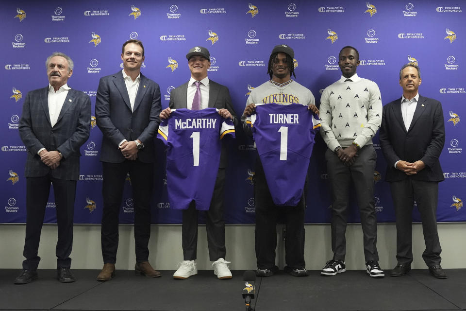 From left to right, Minnesota Vikings owner Zygi Wilf, head coach Kevin O'Connell, first round draft picks J.J. McCarthy and Dallas Turner, general manager Kwesi Adofo-Mensah and owner Mark Wilf pose for a photo before an NFL football press conference in Eagan, Minn., Friday, April 26, 2024. (AP Photo/Abbie Parr)