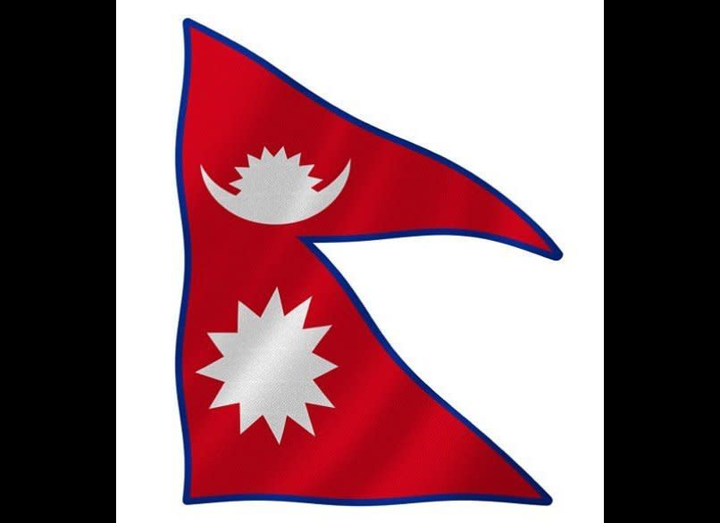 The mountainous land of Nepal boasts the world’s only nonrectangular flag, which has its origins in two separate triangular flags—one displaying the sun and the other the moon—that it once flew one atop the other. The bright crimson background is meant to capture the petals on a red rhododendron, Nepal’s national flower.    <em>Photo: Courtesy iStock Photo</em>