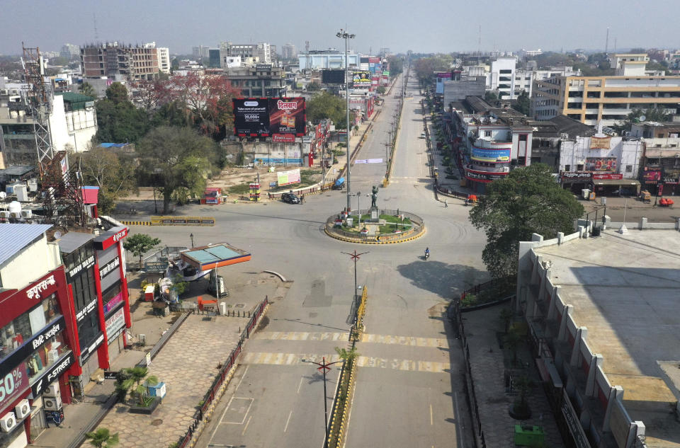 A view of a deserted square in Prayagraj, India, Sunday, March 22, 2020. India is observing a 14-hour “people's curfew” called by Prime Minister Narendra Modi in order to stem the rising coronavirus caseload in the country of 1.3 billion. For most people, the new coronavirus causes only mild or moderate symptoms. For some it can cause more severe illness. (AP Photo/Rajesh Kumar Singh)