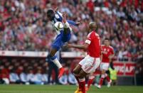 Porto's Jackson Martinez (L) controls the ball next to Benfica's Luisao during their Portuguese premier league soccer match at Luz stadium in Lisbon April 26, 2015. REUTERS/Rafael Marchante