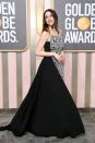 <p>Ana de Armas opted for a swishy ballgown for the evening in the form of a black pleated design by Louis Vuitton which featured a structured printed panel at the front. She chose to wear minimal jewellery with just a statement diamond watch.</p>