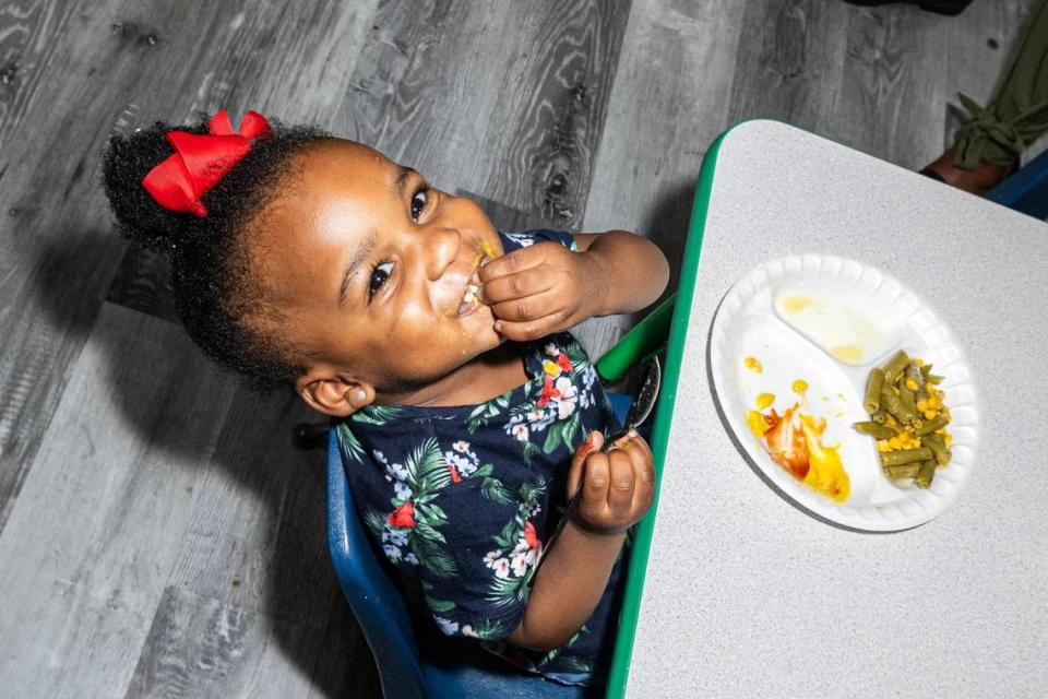 Toddler student Journi Qualls, 2, eats her lunch during lunch break at Sunrise Early Learning and Development Center in Fort Worth on Thursday, Oct. 26, 2023.