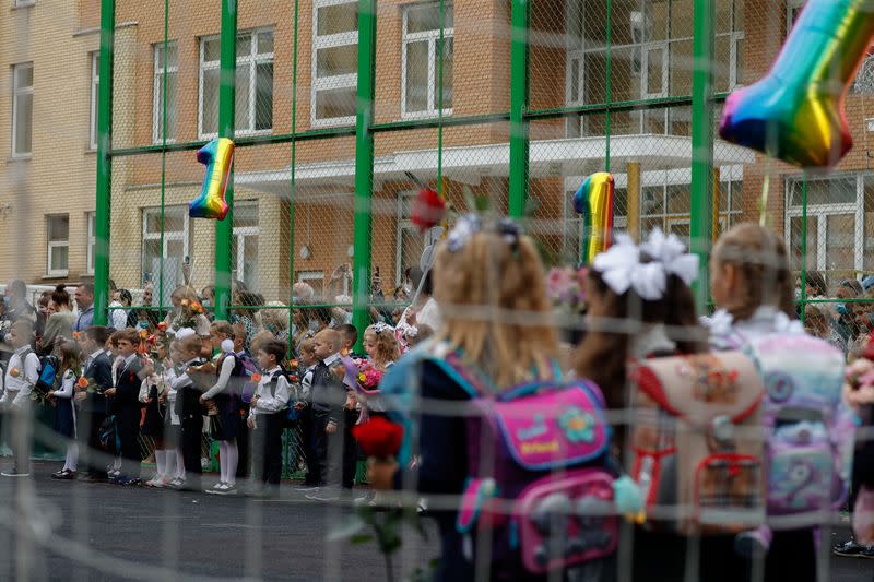 First graders attend a ceremony marking the start of the new school year in Moscow