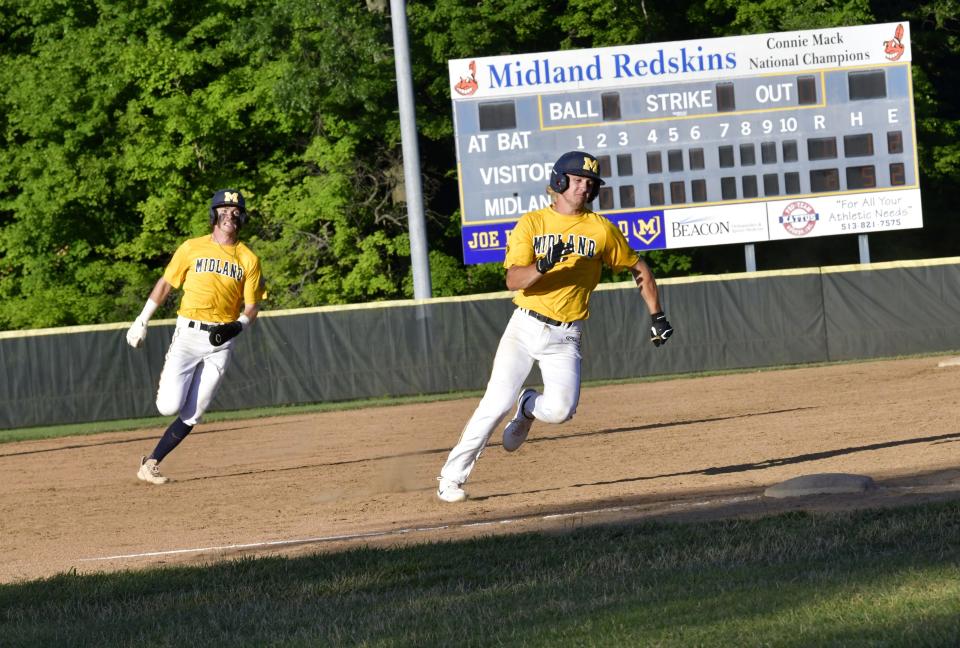 Princeton's Andrew Edrington chases down Elder's Kevin Hilton as they round third base and head for home scoring two more runs for Midland 18U, June 28, 2022.