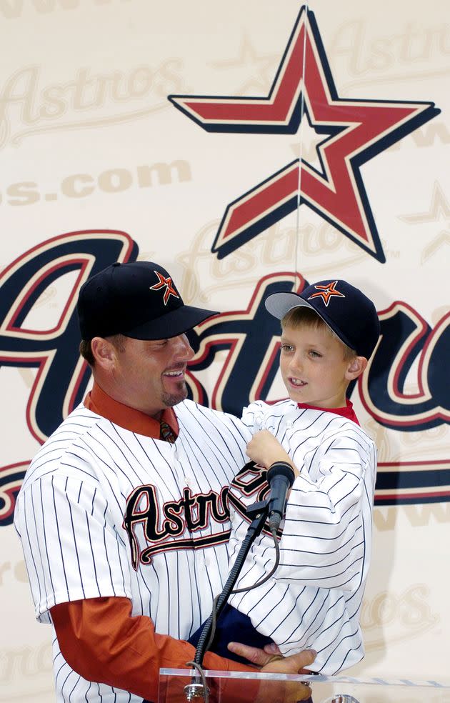 Roger Clemens holds his son, Kody (age 7), during a 2004 press conference. (Photo: Brett Coomer via Getty Images)