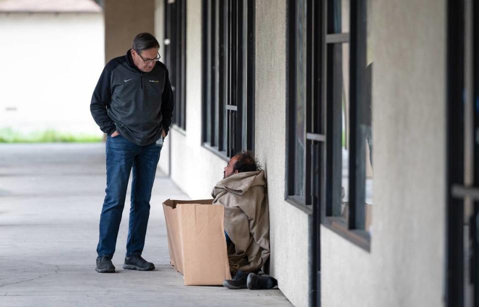 Modesto councilmember Nick Bavaro talks with homeless resident Stefan Zuckerman in Modesto, Calif., Wednesday, March 29, 2023. Andy Alfaro/aalfaro@modbee.com