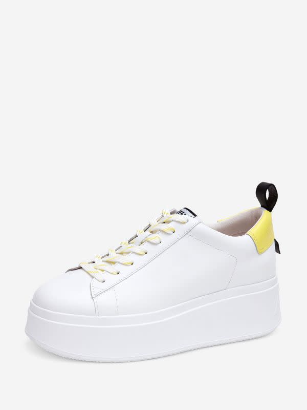 11) Tower above the rest! These white leather sneakers have extra thick platforms. Yellow leather detailing adds a pop of colour.