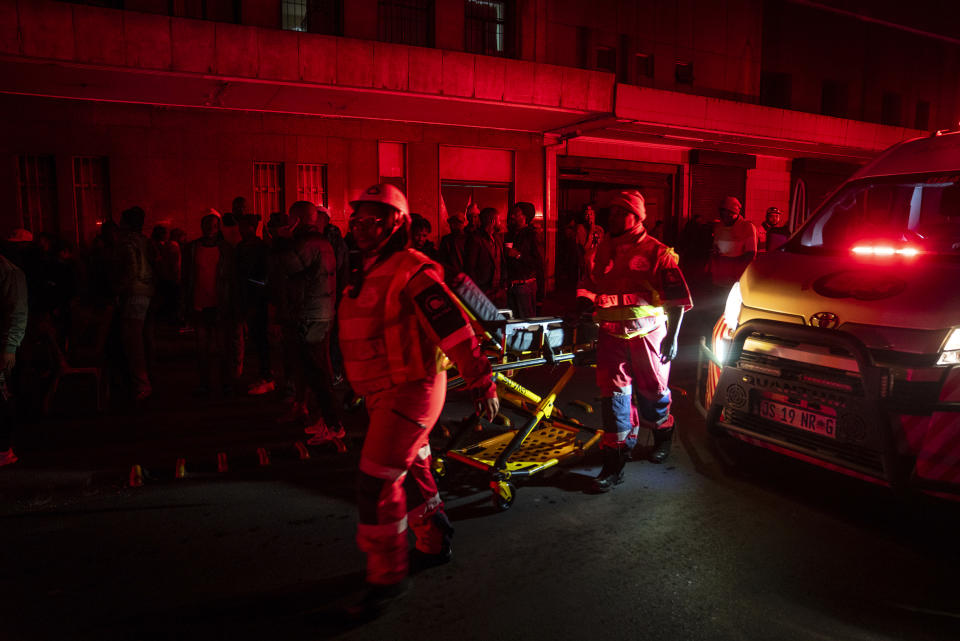 Emergency services gather at the scene of a gas explosion downtown Johannesburg, South Africa, Wednesday July 19, 2023. Search and rescue officials also ordered residents in nearby buildings to evacuate the area and the area where the explosion happened was cordoned off. (AP Photo/Shiraaz Mohamed)