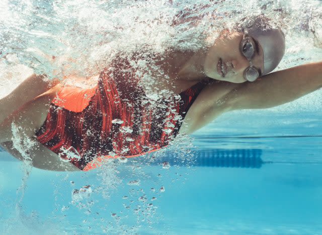 woman swimming for weight loss, concept of low-intensity workouts for women to lose weight