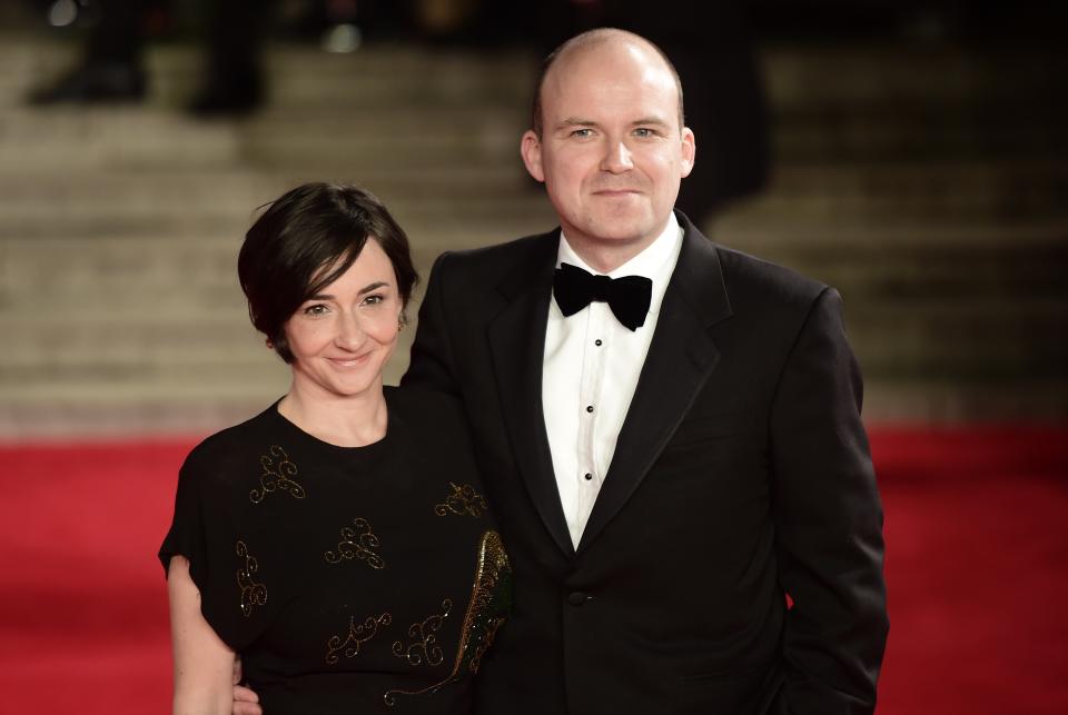 British actor Rory Kinnear (R) poses on arrival for the world premiere of the new James Bond film 'Spectre' at the Royal Albert Hall in London on October 26, 2015. The film is directed by Sam Mendes and sees Daniel Craig play suave MI6 spy 007 for a fourth time.  AFP PHOTO / LEON NEAL        (Photo credit should read LEON NEAL/AFP via Getty Images)