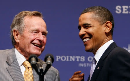 FILE PHOTO: U.S. President Barack Obama is introduced to speak by former President George H.W. Bush at the Points of Light forum at Texas A&M University in College Station, Texas October 16, 2009. REUTERS/Kevin Lamarque/File Photo