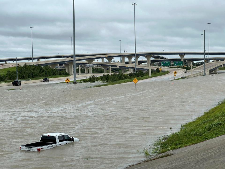 A vehicle is stranded in high waters on a flooded highway in Houston, on Monday, July 8, 2024 after Hurricane Beryl ripped through the area (AP)