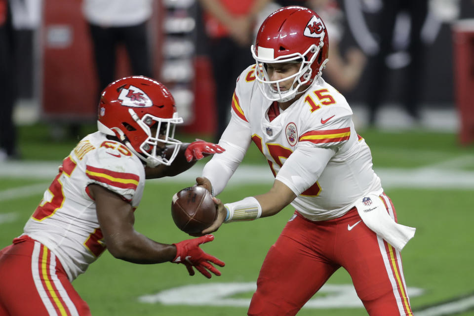 Kansas City Chiefs quarterback Patrick Mahomes (15) hands the ball off to running back Clyde Edwards-Helaire (25) during the first half of an NFL football game against the Las Vegas Raiders, Sunday, Nov. 22, 2020, in Las Vegas. (AP Photo/Isaac Brekken)