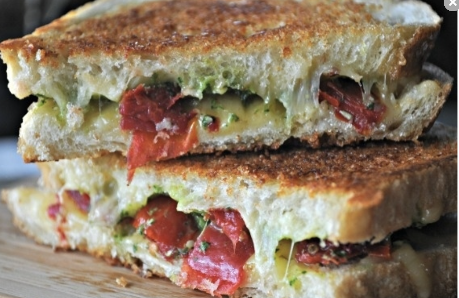 A kick from the spicy havarti and a zing from the cilantro pesto really wakes you up in this artisanal creation. Recipe: Grilled Cheese with Spicy Havarti, Cilantro Pesto, and Roasted Tomatoes
