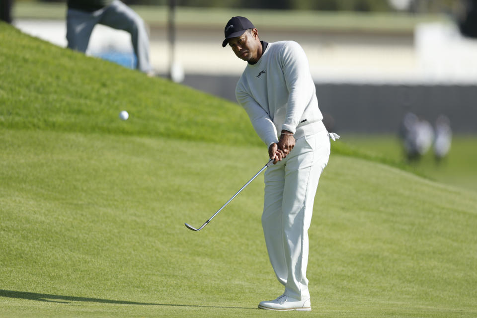 Tiger Woods hits toward the second green during the first round of the Genesis Invitational golf tournament at Riviera Country Club, Thursday, Feb. 15, 2024, in the Pacific Palisades area of Los Angeles. (AP Photo/Ryan Kang)