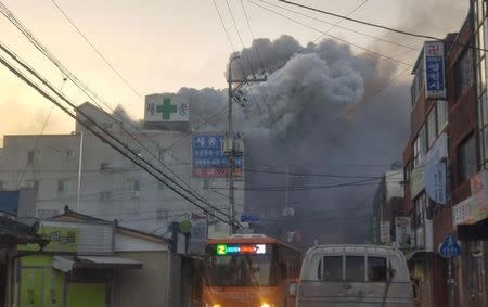 Smoke rises from a burning hospital in Miryang, South Korea, January 26, 2018. Yonhap via REUTERS