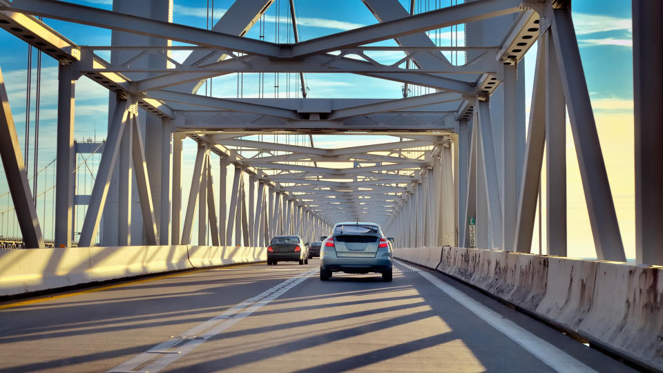 Travelling to the Maryland Eastern Shore across the Chesapeake Bay Bridge from Annapolis, the contrails from jet aircraft arriving from Europe line the sky.