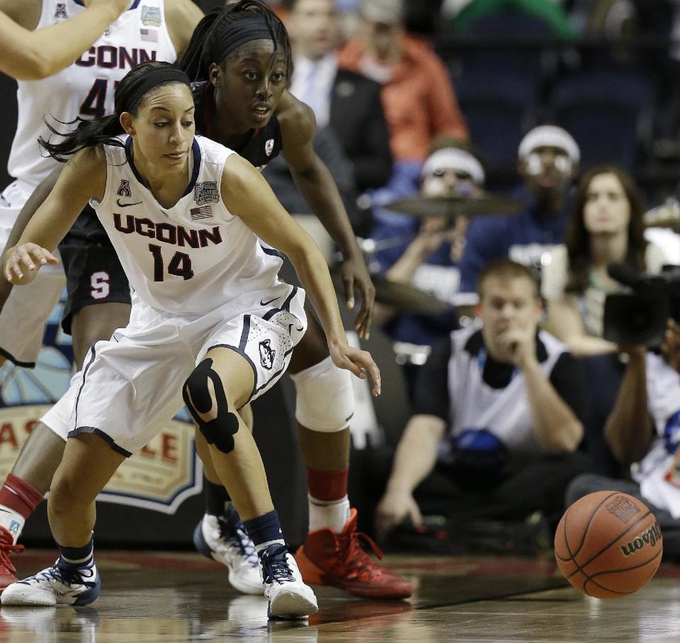 Connecticut guard Bria Hartley (14) and Stanford forward Chiney Ogwumike (13) vie for a loose ball during the first half of the semifinal game in the Final Four of the NCAA women's college basketball tournament, Sunday, April 6, 2014, in Nashville, Tenn. (AP Photo/Mark Humphrey)