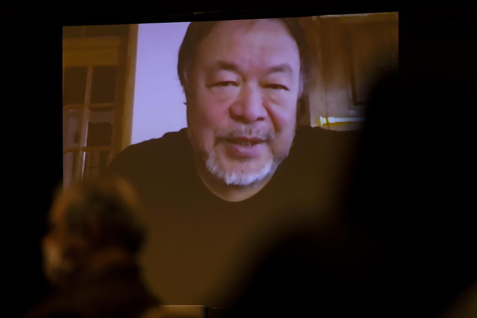 Chinese artist and political activist Ai Weiwei, speaking from Lisbon, Portugal, is seen on a screen during a virtual news conference at the Foreign Corespondents' Club of Japan in Tokyo Friday, Jan. 22, 2021. Ai said that his latest documentary “Coronation” has been refused to be exhibited at major film festivals and online TV platforms due to its sensitivity. (AP Photo/Hiro Komae)