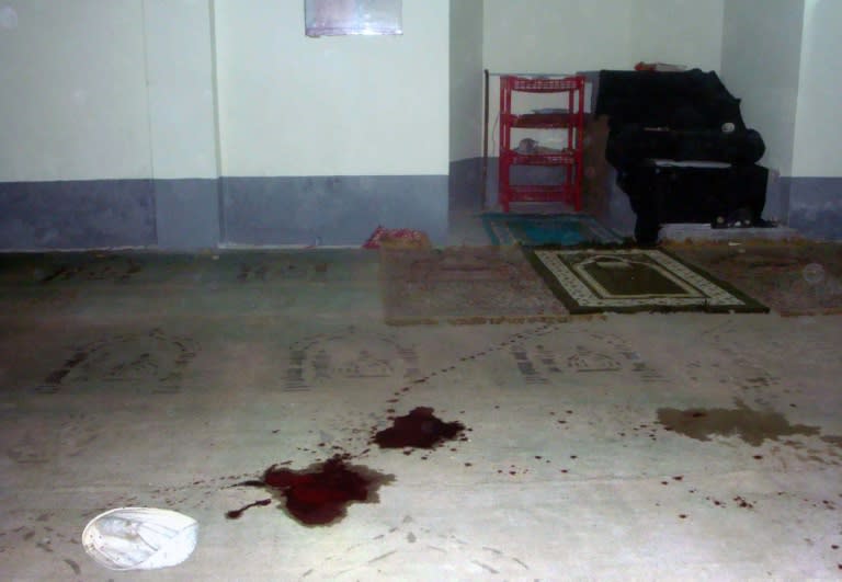 Blood stains are seen on the floor of a Shiite mosque after a shooting in Shibganj, northern Bangladesh, some 125 km from the capital Dhaka, on November 26, 2015