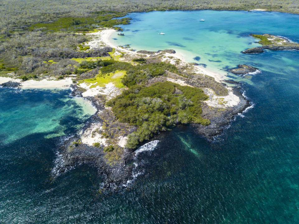 Aerial view of the sandy Cerro Brujo Beach at the north western coast of San Cristobal Island, Galapagos, Ecuador.