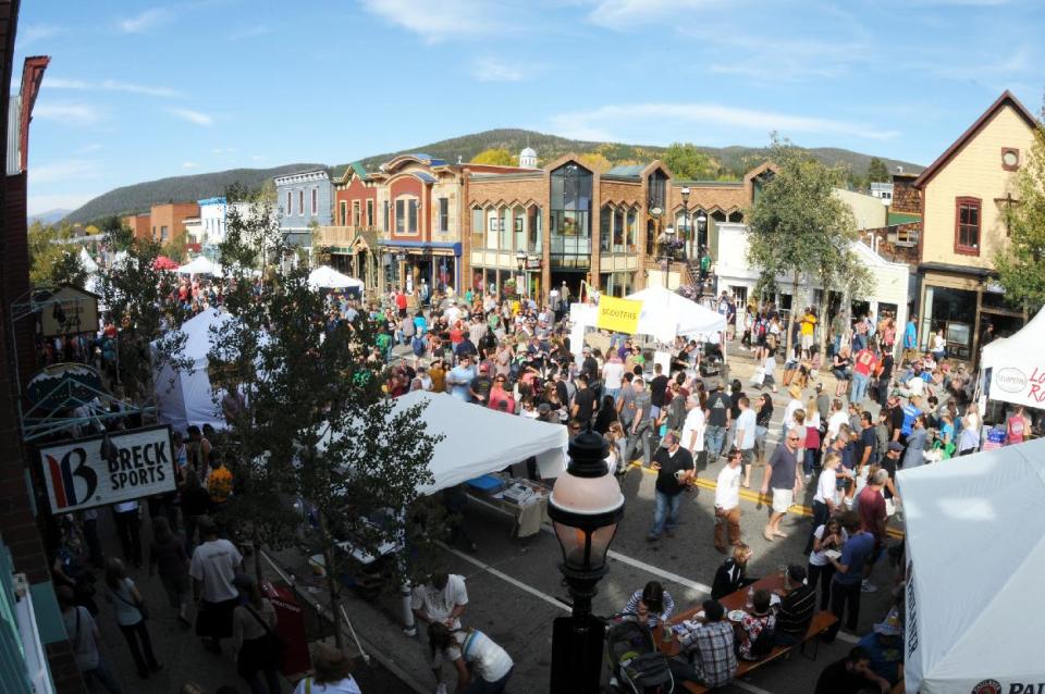 This 2012 photo provided by GoBreck shows crowds at the annual Oktoberfest celebration in Breckenridge, Colo. Breckenridge may be best known as a ski resort but it offers many summer and fall activities and events for visitors, along with offseason deals. (AP Photo/GoBreck, Robin Johnson)