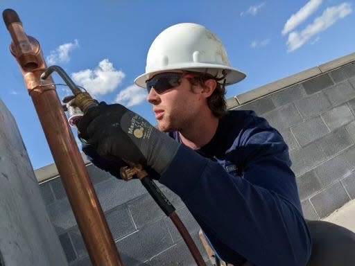 Prime Drain Cleaning and Plumbing Owner Brycen Sperlich works on a pipe in Nashville.