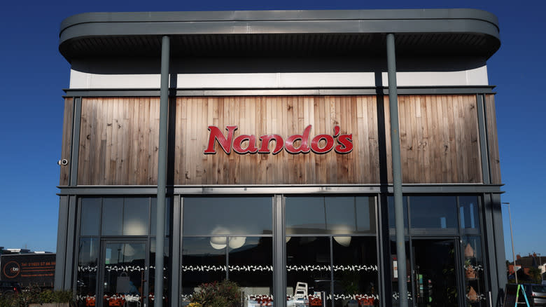 Nando's storefront at dusk