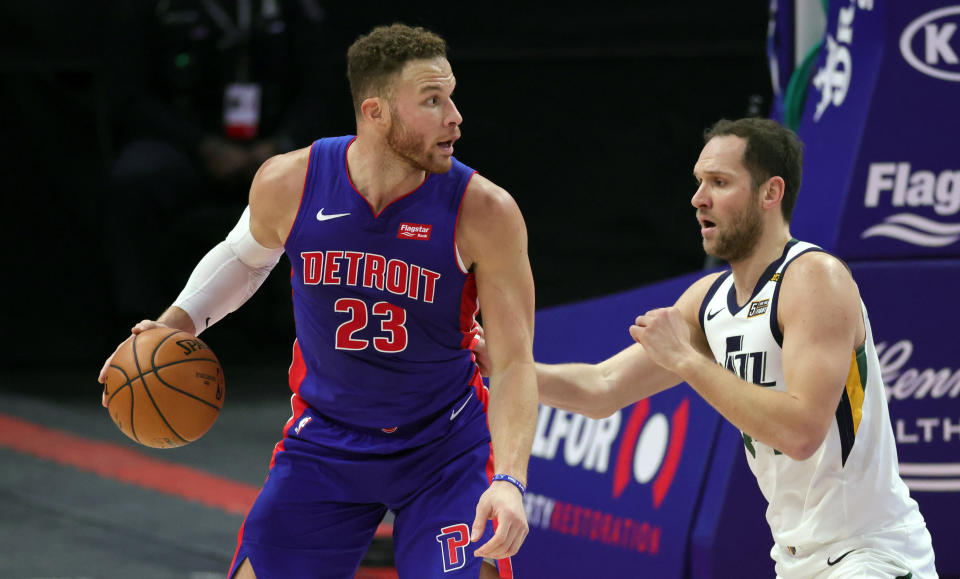 Blake Griffin #23 of the Detroit Pistons looks to shoot the ball as Joe Ingles #2 of the Utah Jazz defends during the fourth quarter of the game against the Detroit Pistons at Little Caesars Arena.