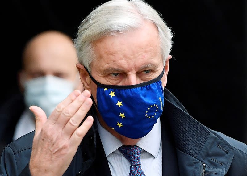 FILE PHOTO: The European Union's chief Brexit negotiator, Michel Barnier, wearing a face mask as he walks to Brexit trade negotiations in London