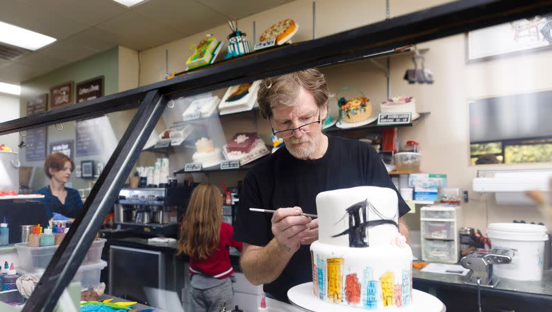 Jack Phillips, owner of Masterpiece Cakeshop in Lakewood, Colo., decorates a cake for a client on Sept. 21, 2017.