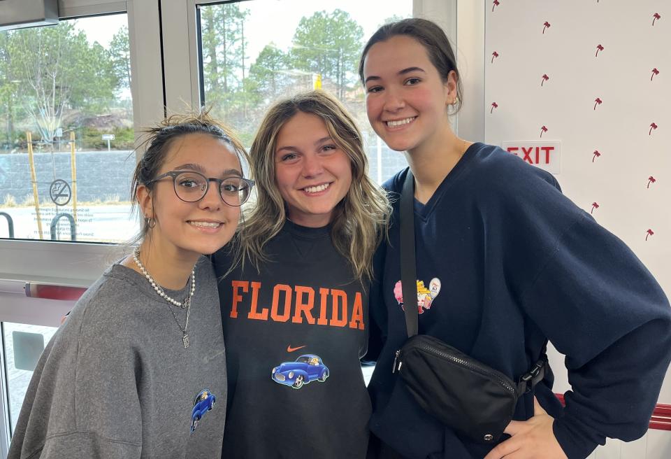 Anjali Cooper (left), Olyvia Beaver and Ainsley Kelly were among the customers at the grand opening of In-N-Out Burger on Milton Road in Flagstaff on Friday, April 5, 2024.