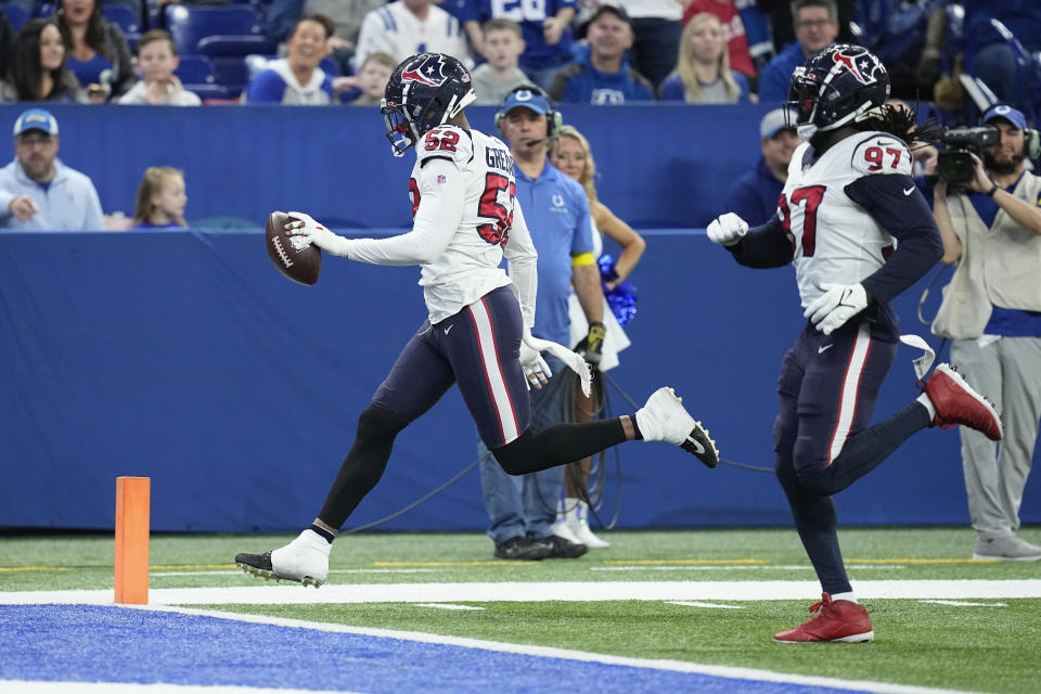 Houston Texans defensive end Jonathan Greenard (52) scores after an interception during the first half of an NFL football game between the Houston Texans and Indianapolis Colts, Sunday, Jan. 8, 2023, in Indianapolis. (AP Photo/Darron Cummings)