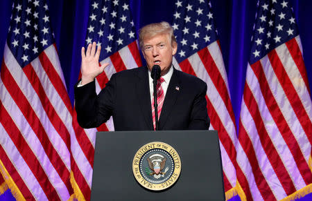 U.S. President Donald Trump gestures as he speaks during his visit at the Civil Rights Museum in Jackson, Mississippi, U.S. December 9, 2017. REUTERS/Kevin Lamarque