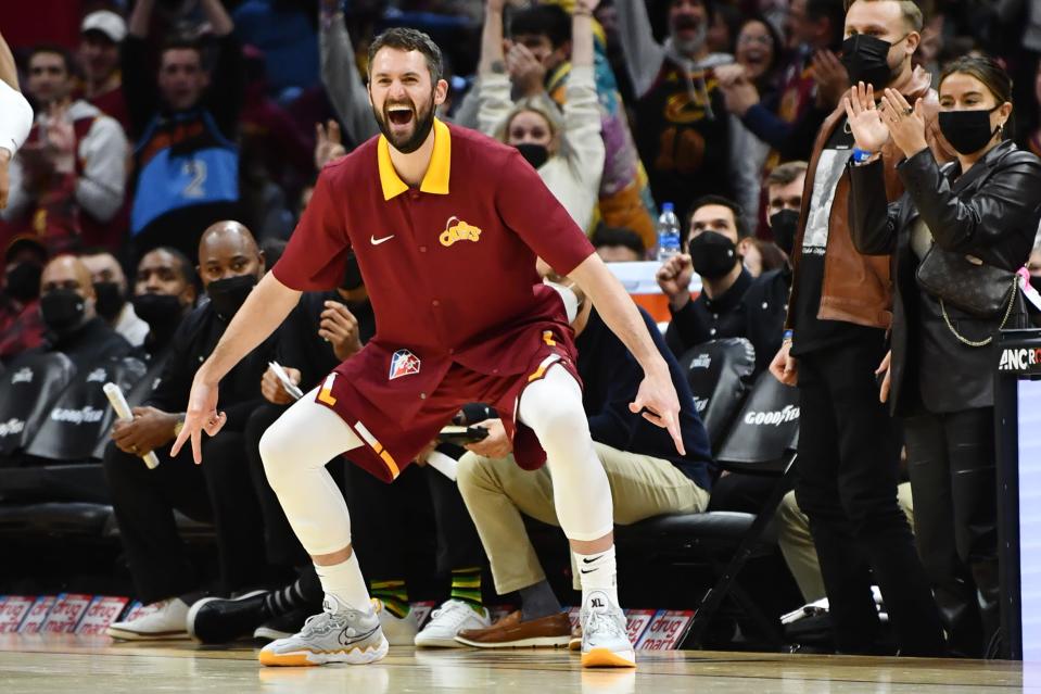 Cavaliers forward Kevin Love celebrates a teammate's 3-point basket.